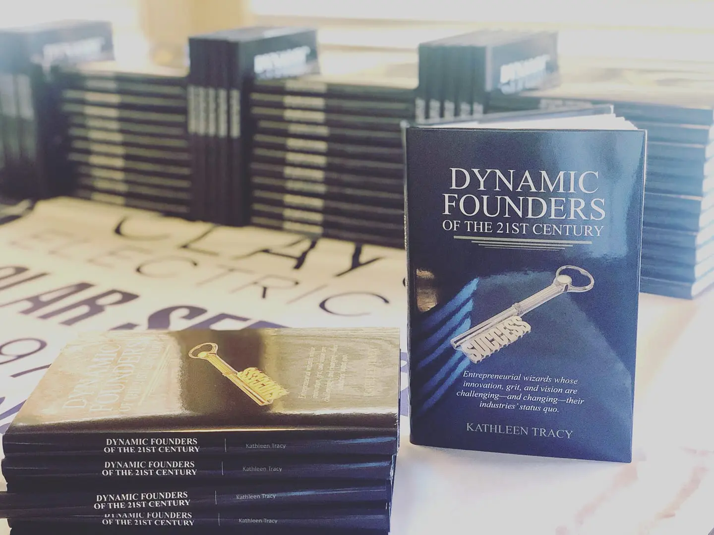 A stack of books with the cover for dynamic founders